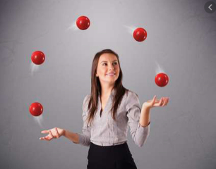 woman juggling five red balls